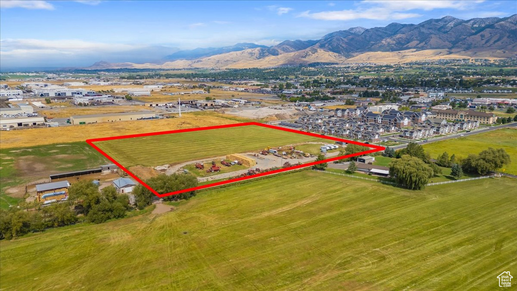 Birds eye view of property with a mountain view