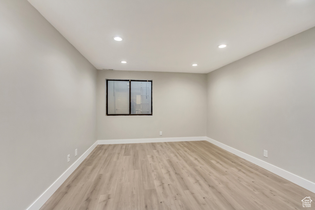 Empty room featuring light wood-type flooring