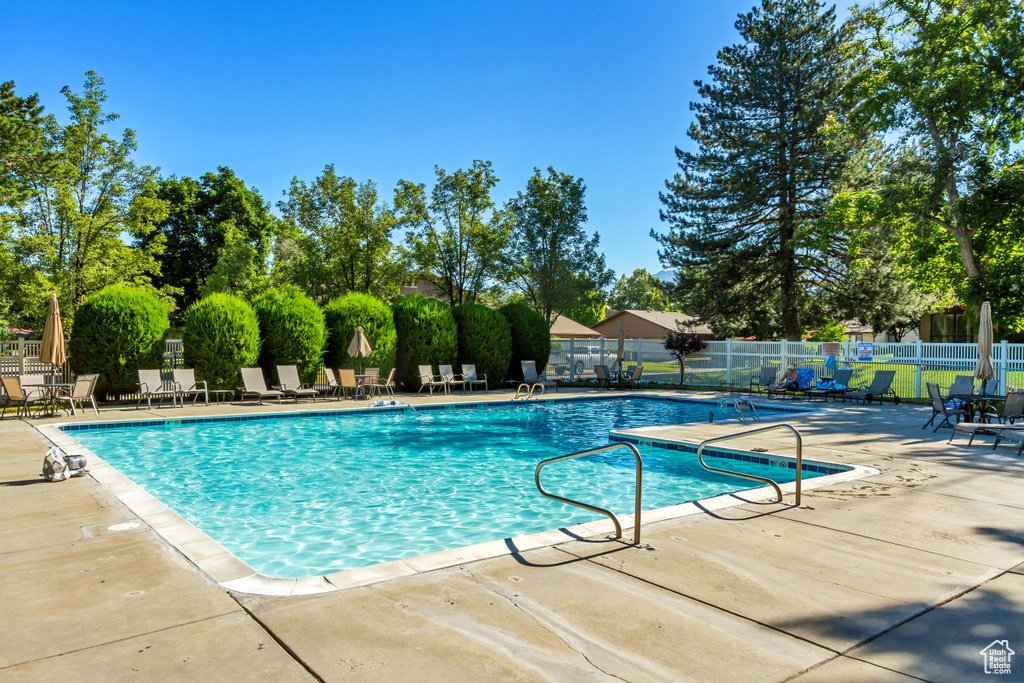 View of swimming pool featuring a patio area