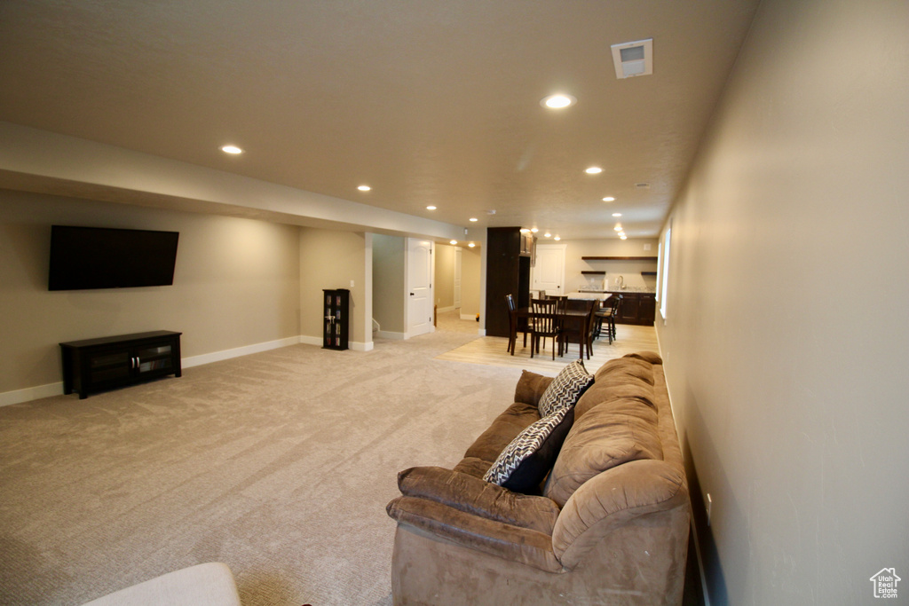 Living room featuring light carpet