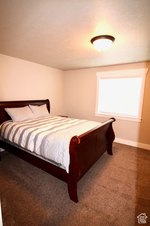 Bedroom featuring carpet floors