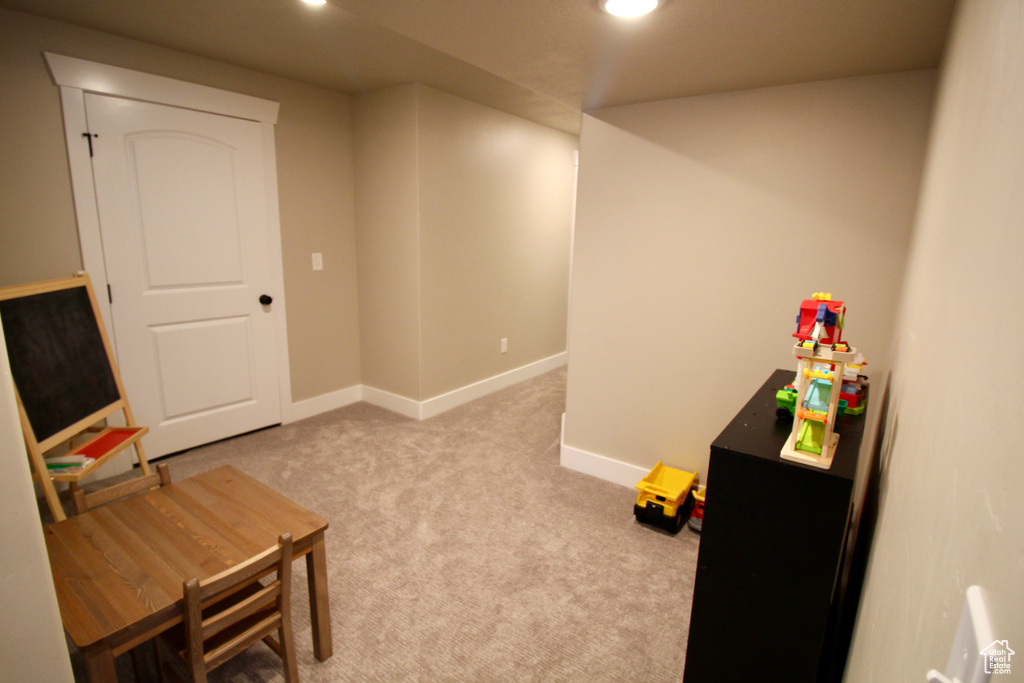 Rec room with light carpet