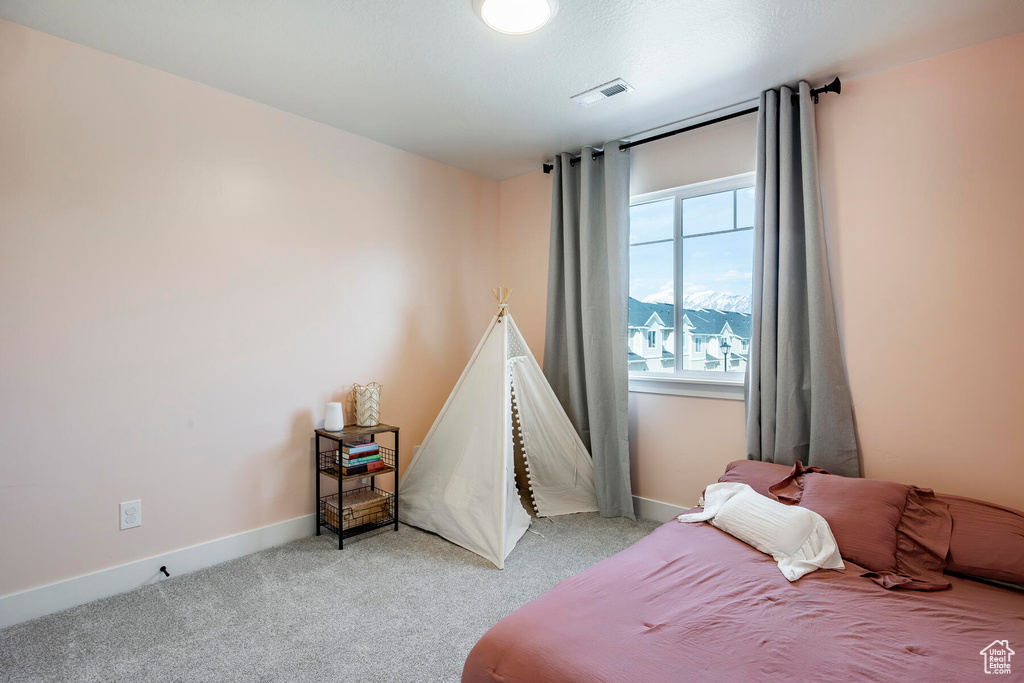 Bedroom featuring carpet flooring