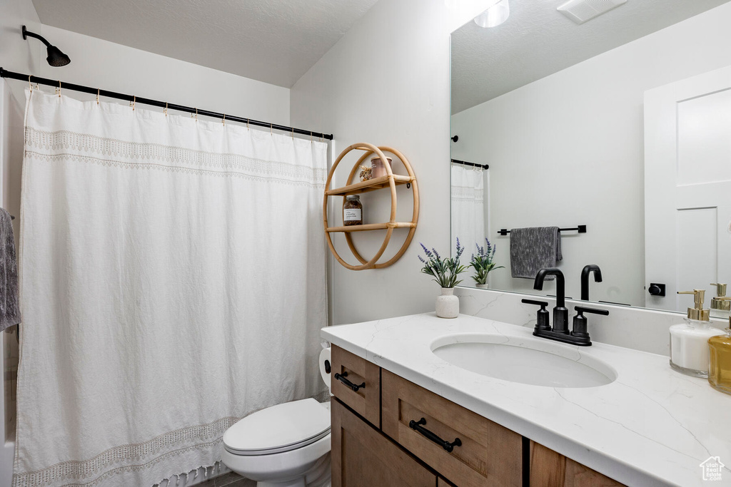 Bathroom with vanity and toilet