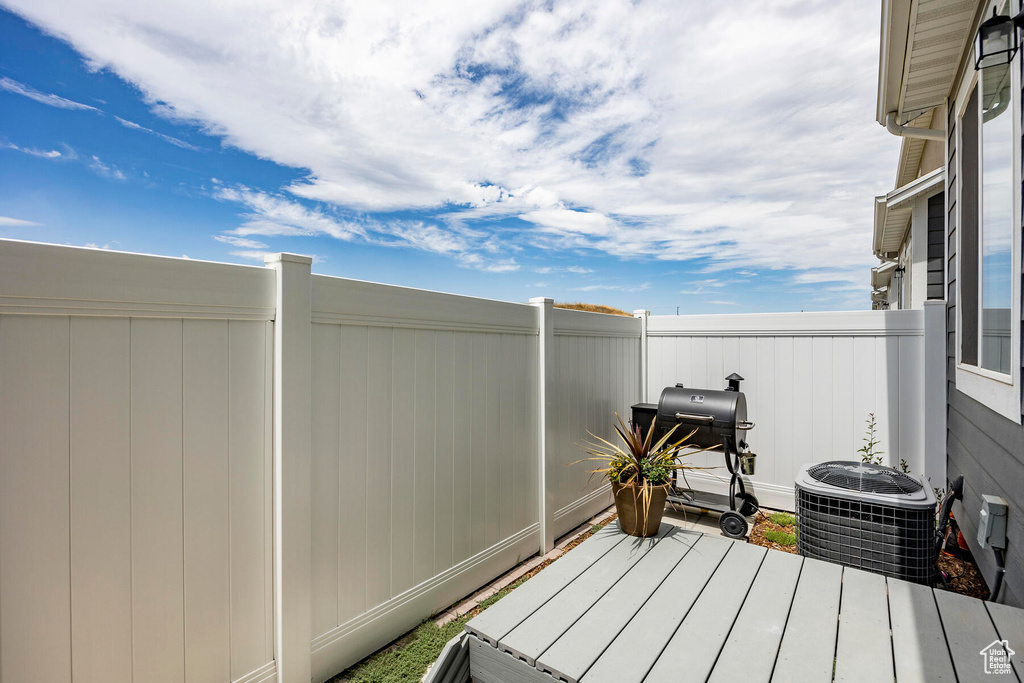 Exterior space featuring area for grilling and central air condition unit