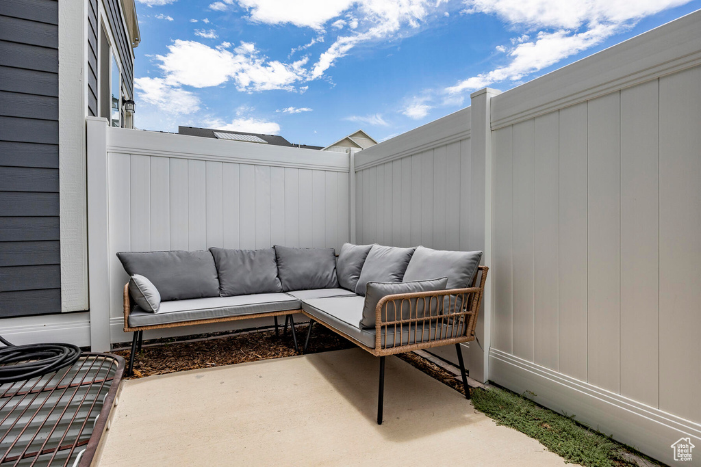 View of patio with an outdoor hangout area