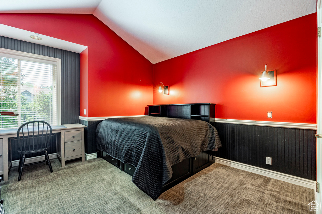 Carpeted bedroom with vaulted ceiling