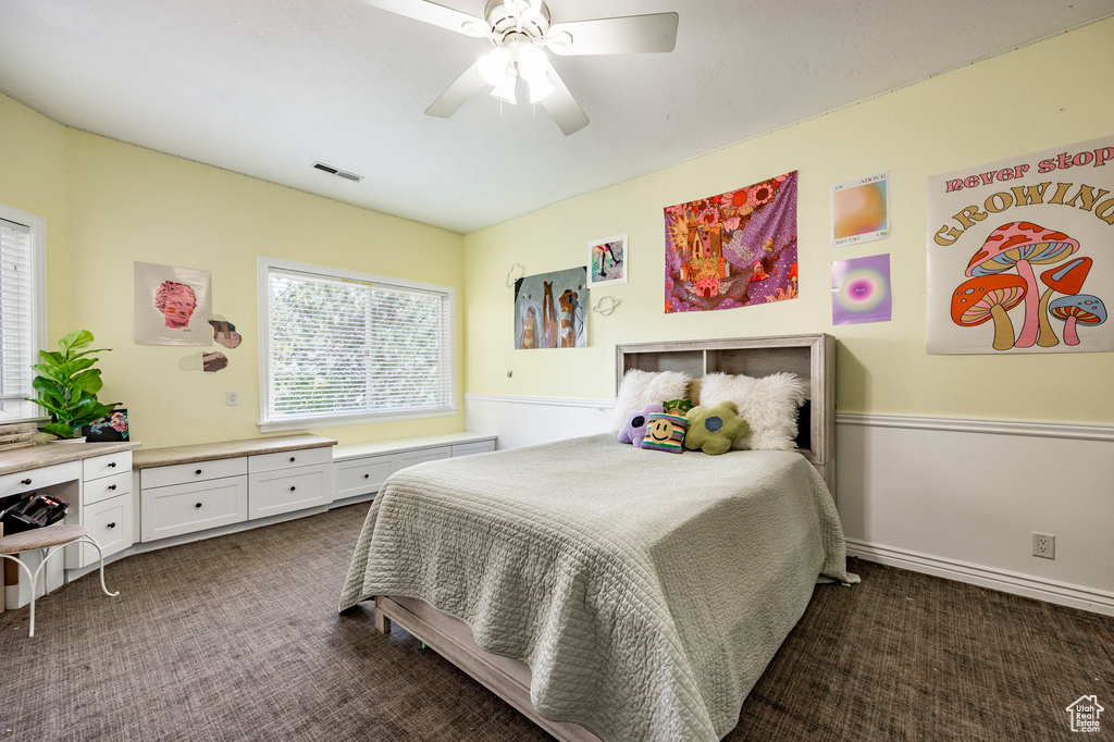 Bedroom featuring ceiling fan and carpet