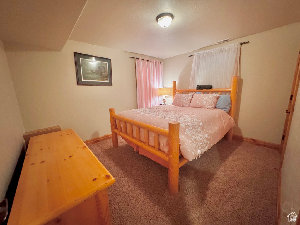 Bedroom featuring carpet floors