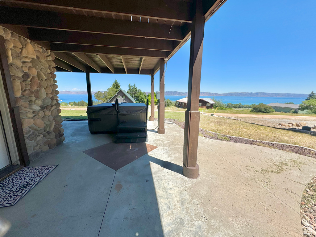 View of patio featuring a water view