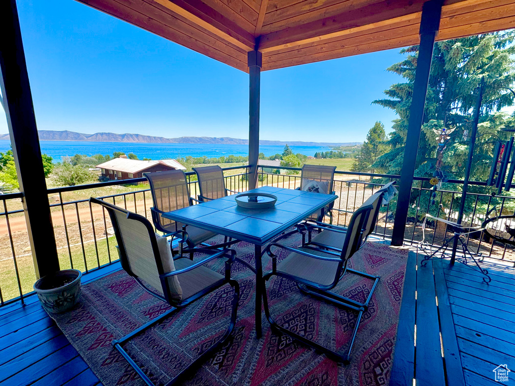 Deck featuring a water and mountain view