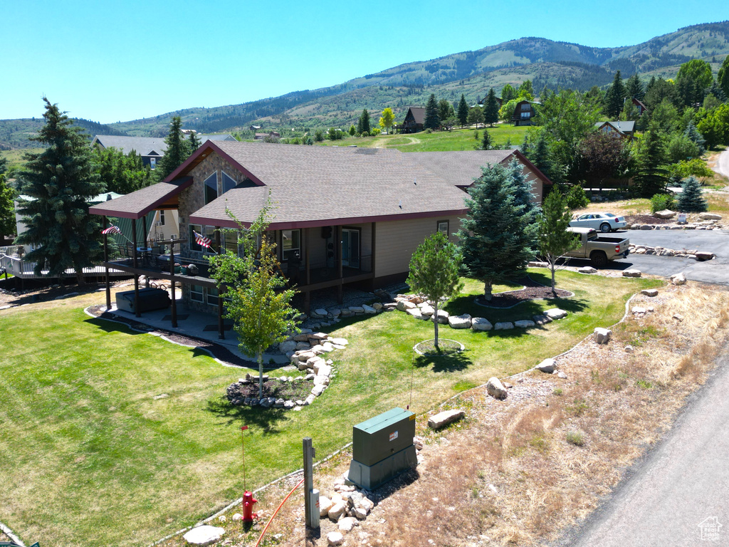 View of home\\\\\\\\\\\\\\\'s exterior with a yard, a gazebo, and a deck with mountain view