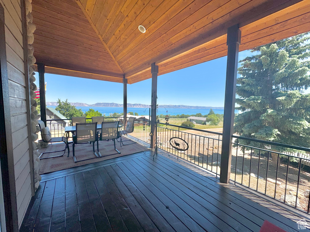 Wooden deck featuring a water view