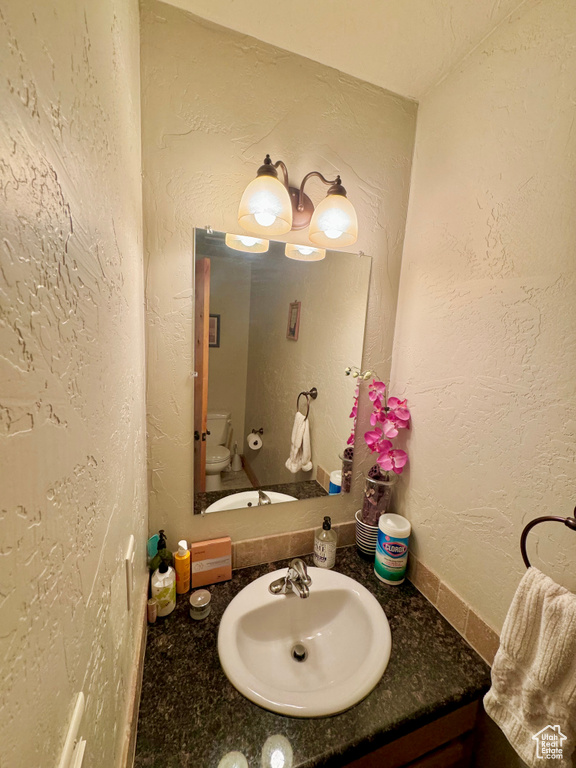 Bathroom with vanity and toilet