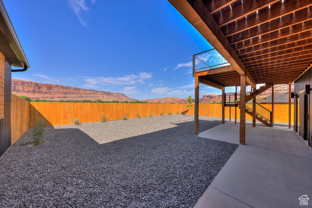 View of yard with a mountain view and a patio