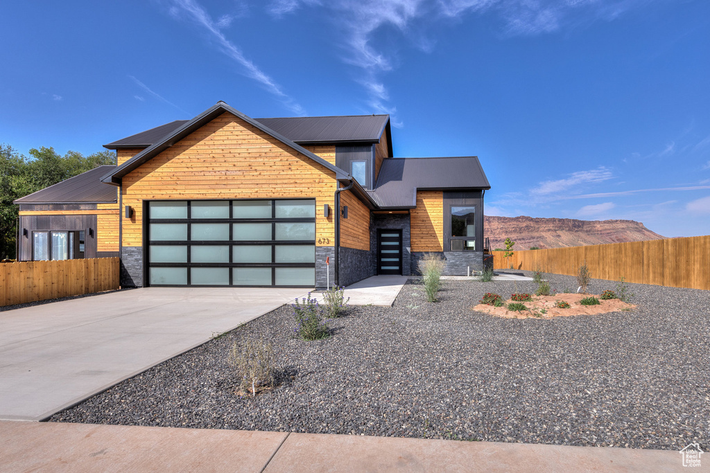 Contemporary house with a garage and a mountain view