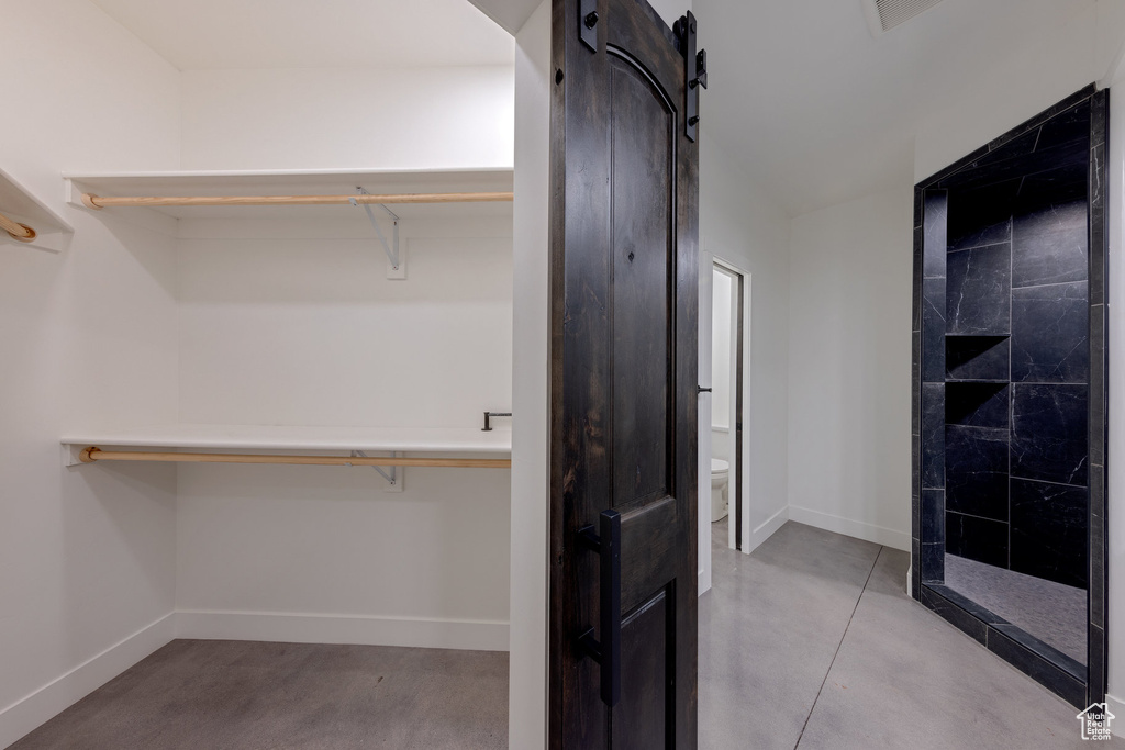 Spacious closet with a barn door