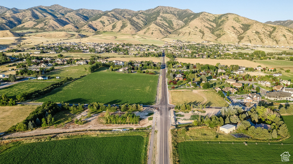 Birds eye view of property with a mountain view and a rural view