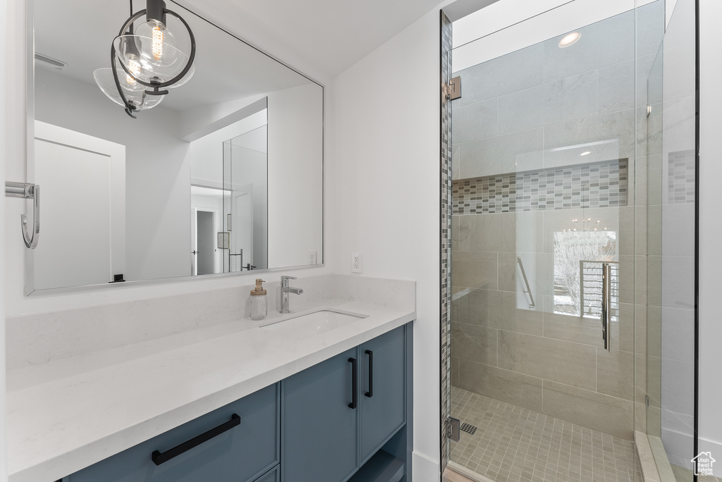 Bathroom with vanity and an enclosed shower