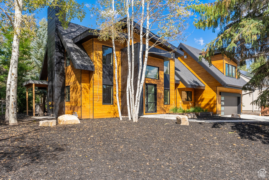 View of front of property featuring a garage