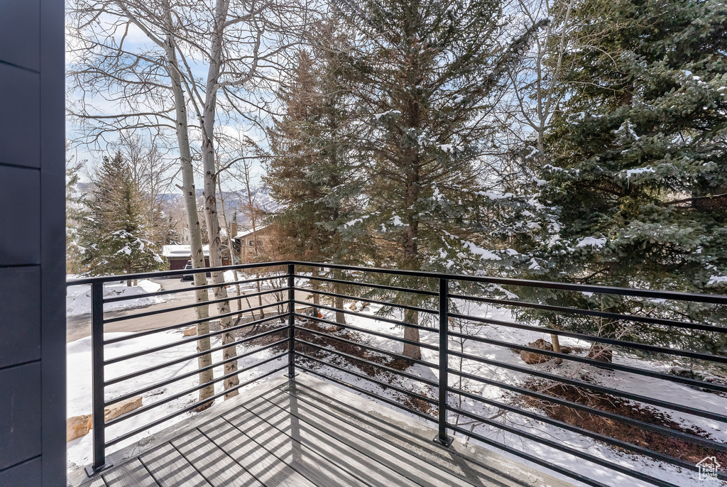 View of snow covered back of property