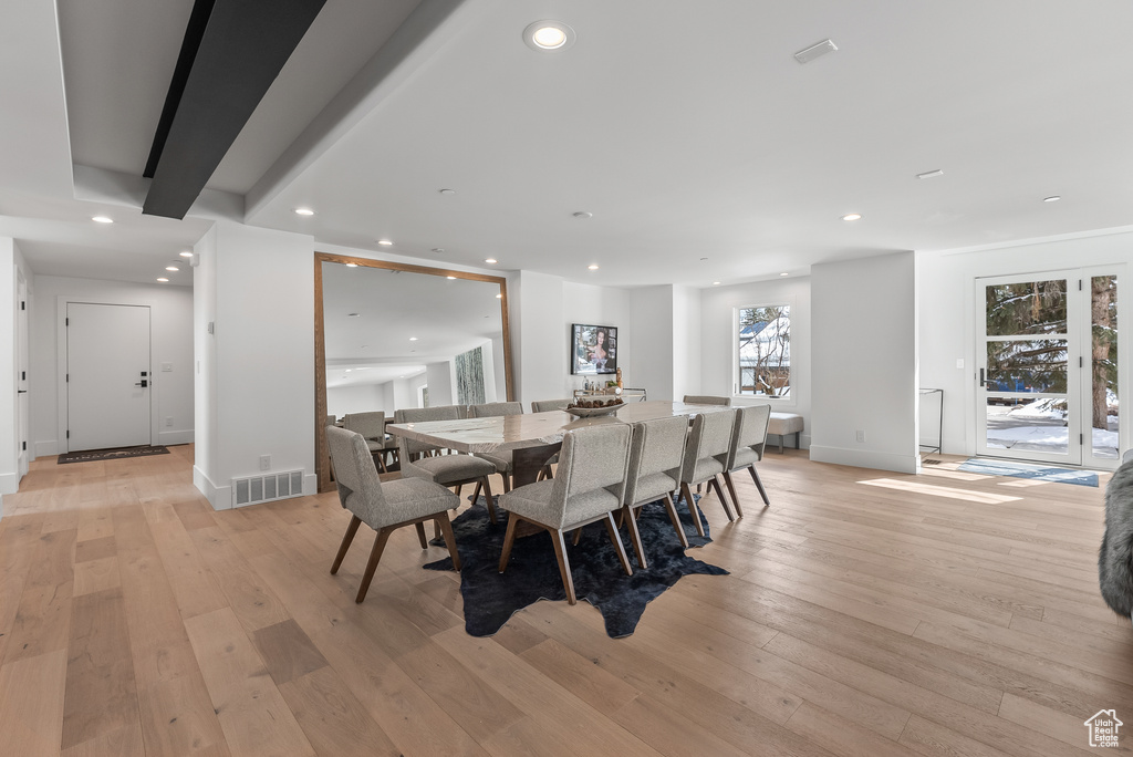 Dining area with light wood-type flooring