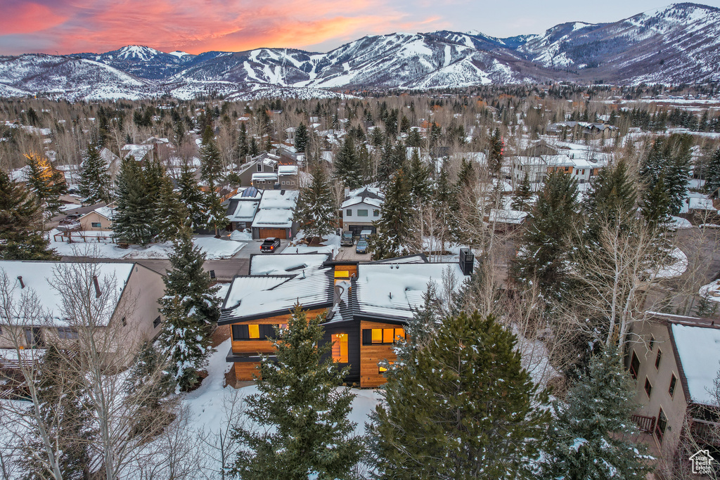 Snowy aerial view featuring a mountain view