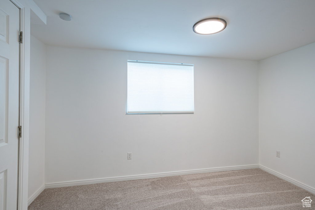 Unfurnished room with carpet