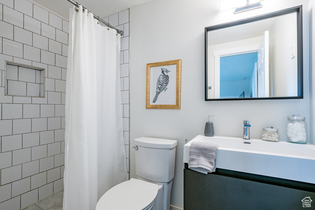 Bathroom featuring vanity and toilet