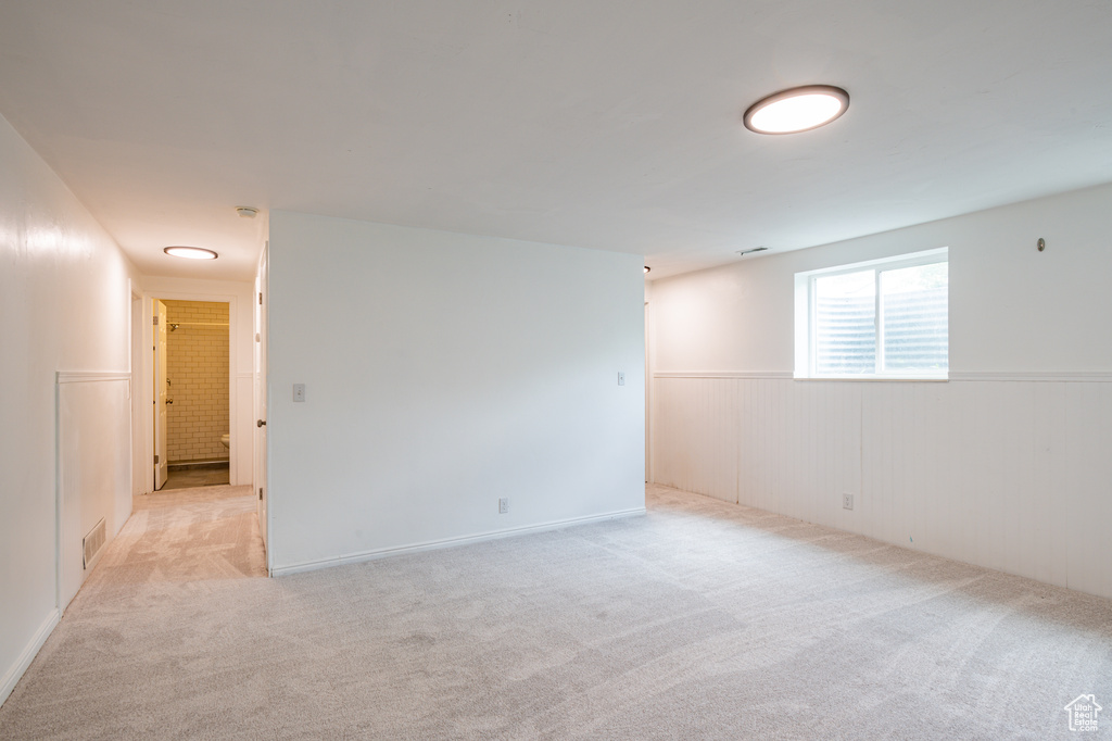 Spare room featuring light colored carpet