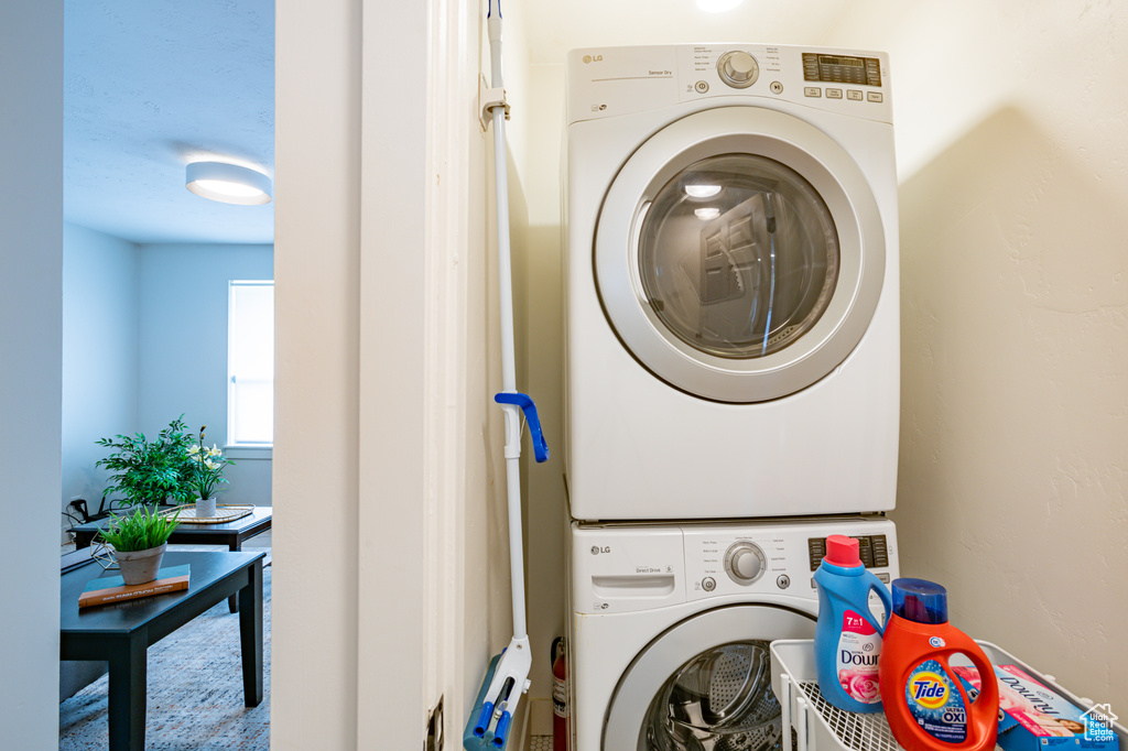 Clothes washing area with stacked washer / dryer