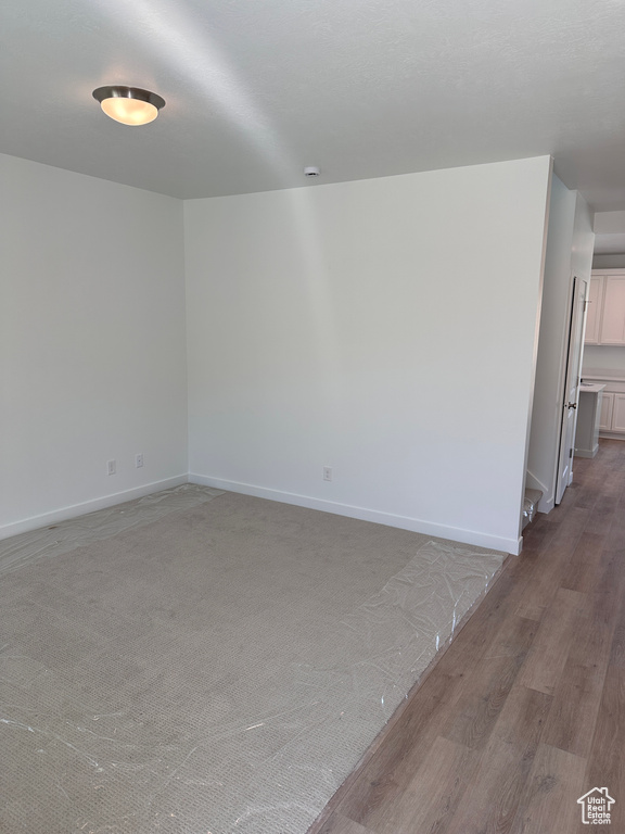 Spare room featuring light wood-type flooring