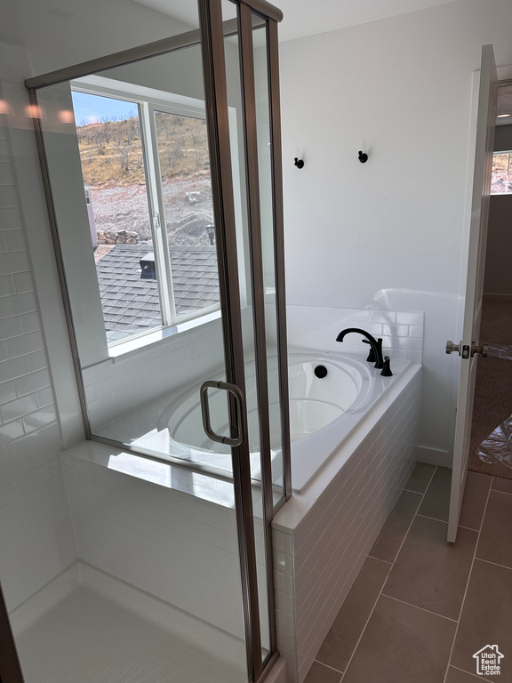 Bathroom with plus walk in shower and tile patterned floors