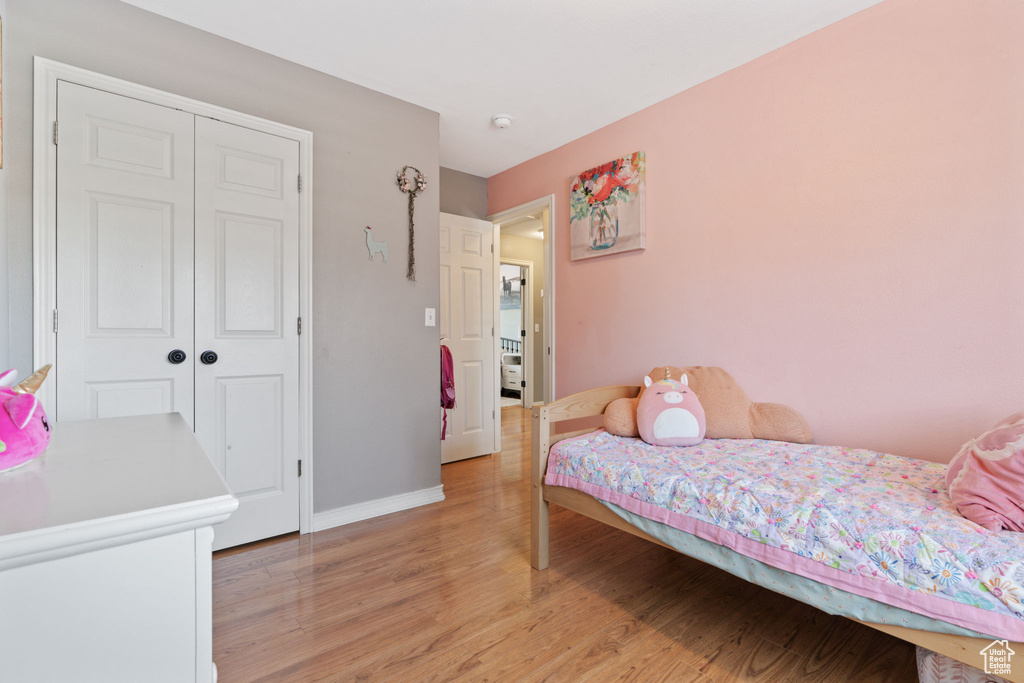 Bedroom featuring a closet and light wood-type flooring