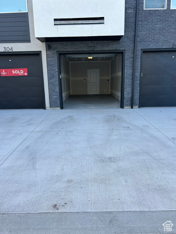 View of exterior entry featuring a garage