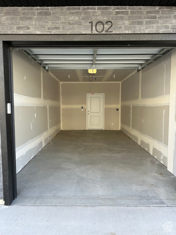 Garage featuring a garage door opener