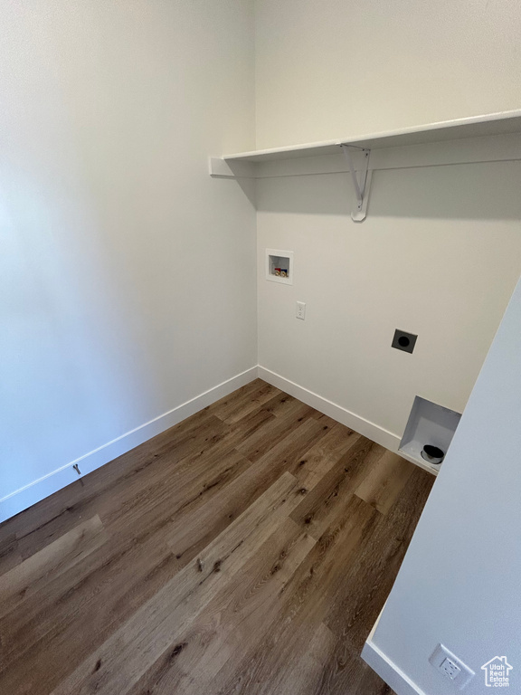 Laundry room featuring wood-type flooring, electric dryer hookup, and washer hookup
