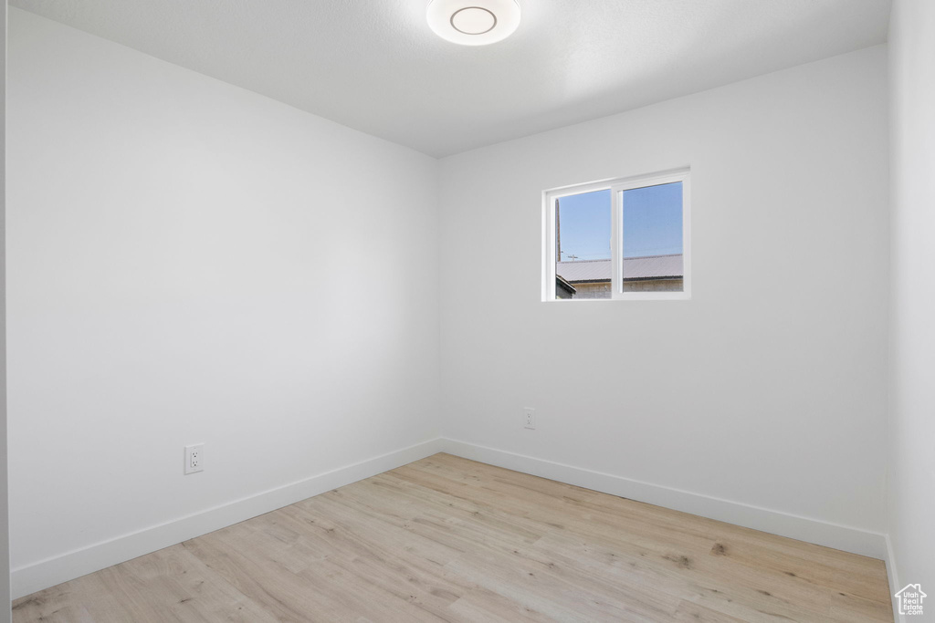 Empty room with light wood-type flooring