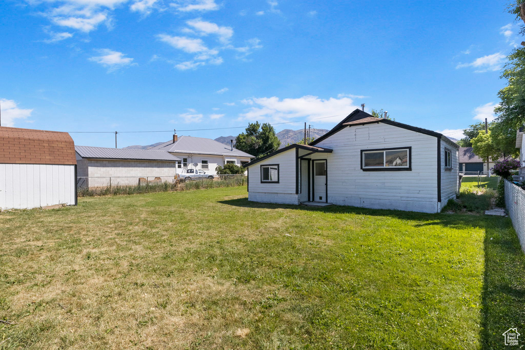 View of yard featuring a storage unit