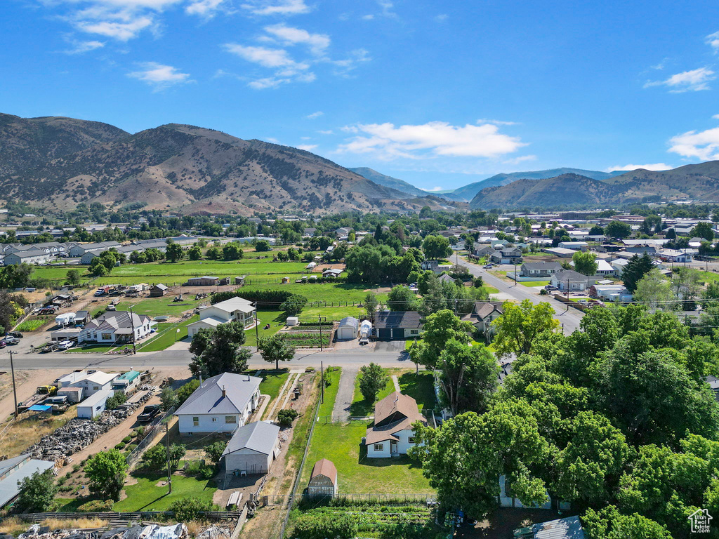 Birds eye view of property with a mountain view