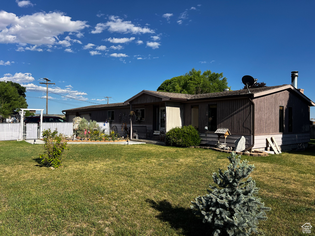 View of front of property with a front lawn