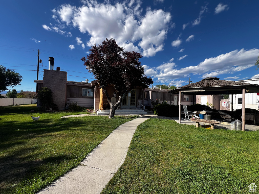 View of front of house with a front lawn