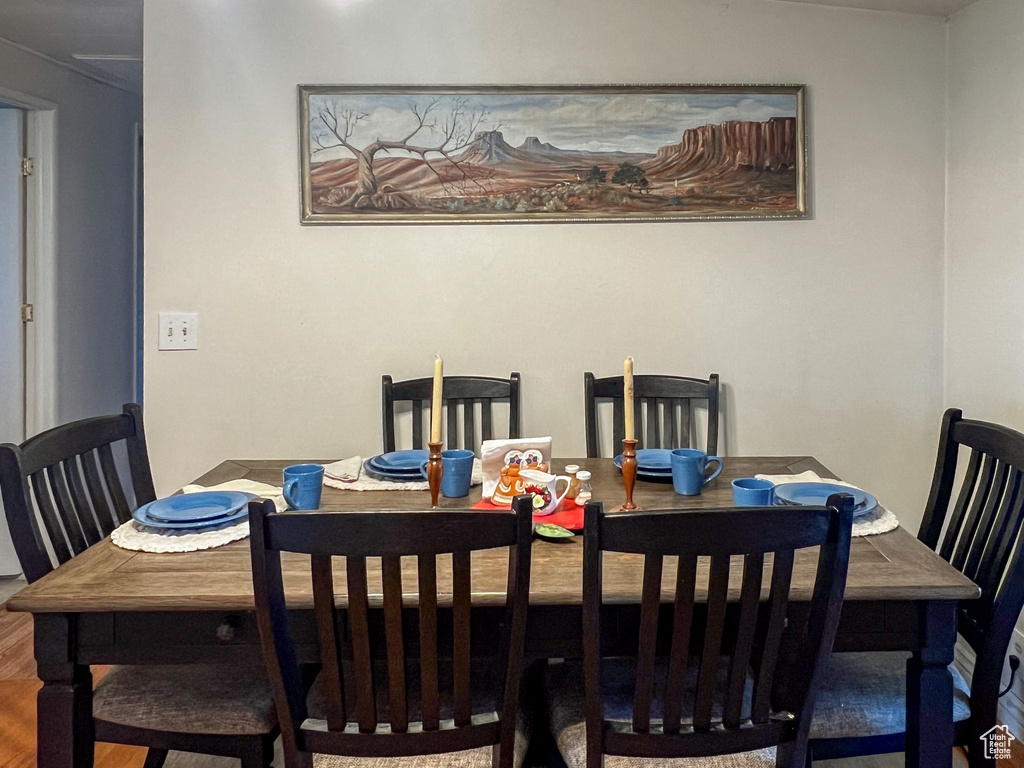 Dining area with hardwood / wood-style flooring