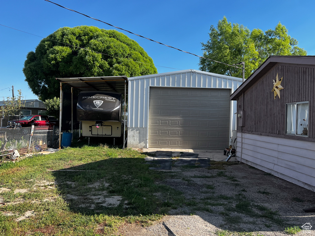 Garage featuring a yard