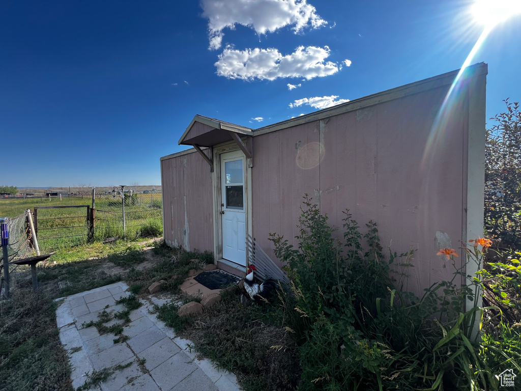 View of outdoor structure with a rural view