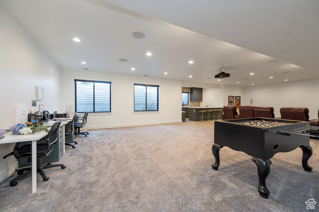 Game room with light colored carpet