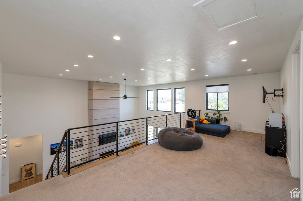 Interior space featuring carpet flooring and ceiling fan