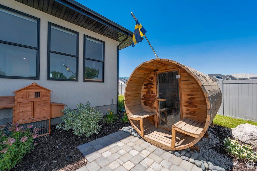 View of patio / terrace featuring a storage shed