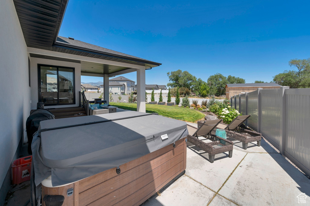 View of patio featuring a hot tub