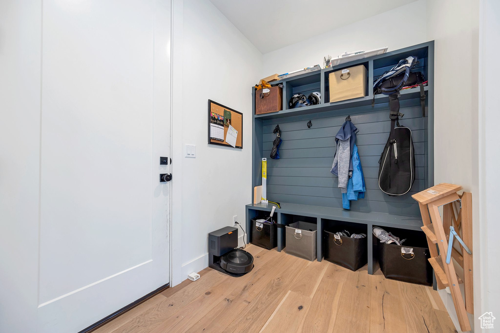 Mudroom with light hardwood / wood-style flooring